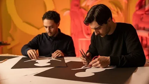 Animators creating cut out animation